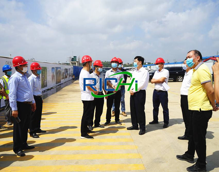 Local government leaders inspect the construction progress of the biomass pelleting plant project